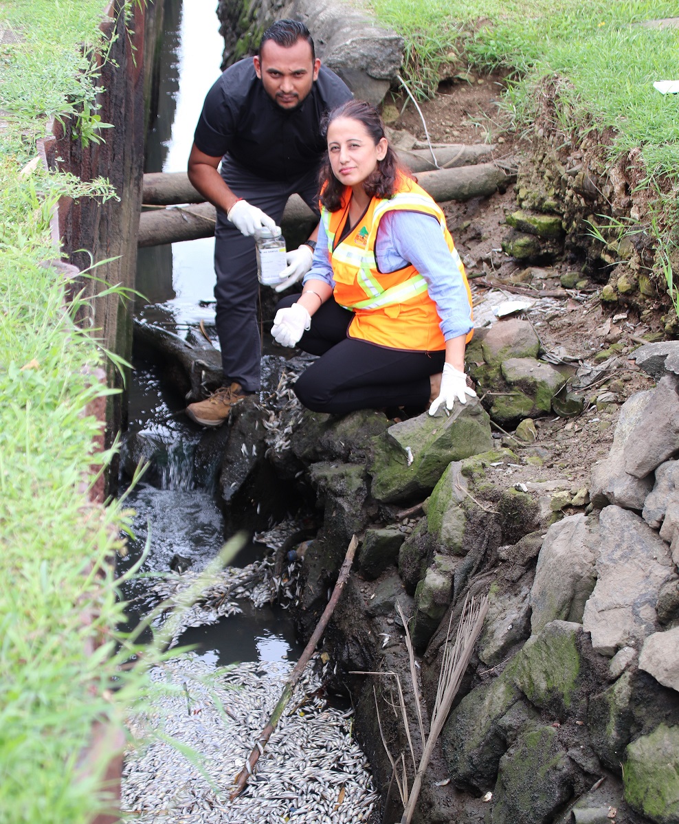 Fiji's Director Environment Sandeep Singh and PEO WPC Kavnil Lal collecting samples from the site. Picture: SUPPLIED 