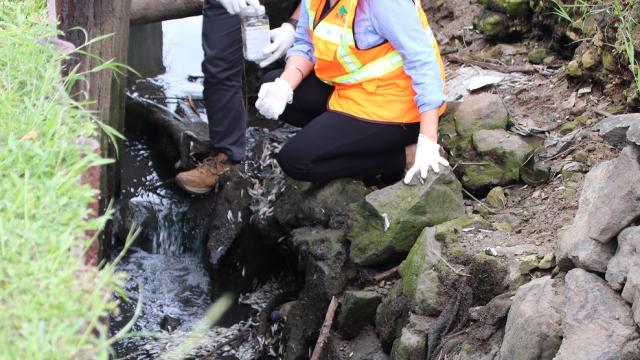 Fiji's Director Environment Sandeep Singh and PEO WPC Kavnil Lal collecting samples from the site. Picture: SUPPLIED 